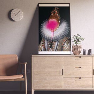 May include: A framed portrait of a woman wearing a white lace collar and a gold and red dress. Her face is obscured by a pink spray paint splatter.