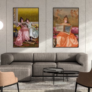 May include: Two framed paintings of women in vintage dresses. The painting on the left shows two women sitting on a couch, one reading a book. The painting on the right shows a woman sitting on a couch, reading a newspaper. Both paintings have a yellow background.