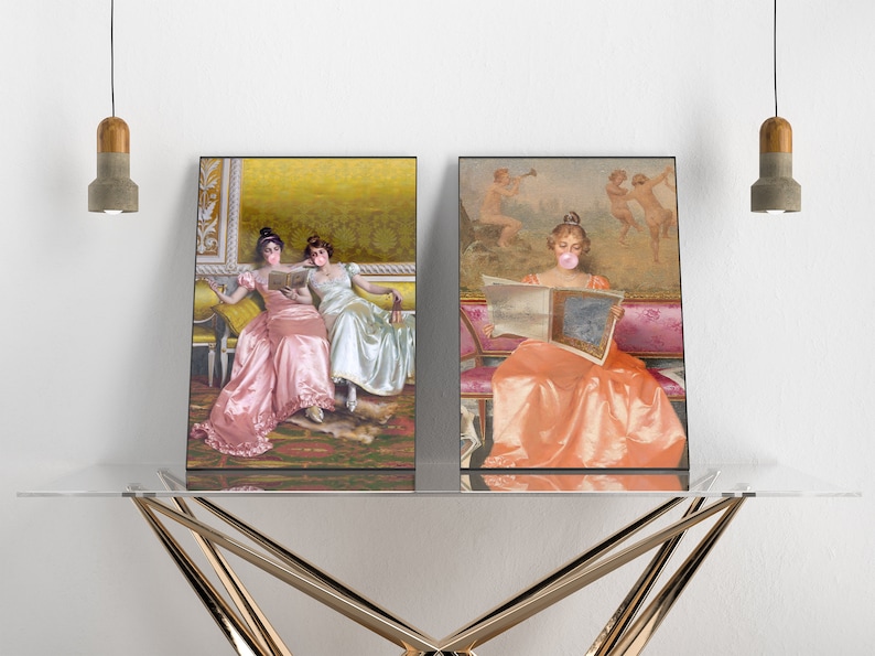May include: Two framed prints of women in vintage dresses. The woman in the left print is reading a book with another woman. The woman in the right print is reading a newspaper and has a bubble of pink gum in her mouth.