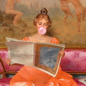 May include: A woman in an orange dress sits on a pink couch and reads a newspaper. She is blowing a pink bubble with her mouth.