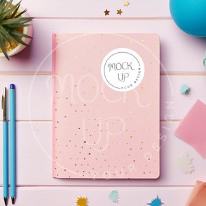 May include: Pink notebook with gold glitter and a white circle sticker that says "Mock Up Your Design".