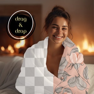 May include: A woman wearing a white blanket with a checkered pattern on one side and a floral pattern on the other side. The floral pattern features pink flowers and grey leaves on a light pink background.