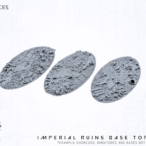 May include: Three grey oval Imperial Ruins Base Toppers, each covered in detailed rubble and debris. The text "3X PIECES" is at the top, and "IMPERIAL RUINS BASE TOPPER" is at the bottom of the image.