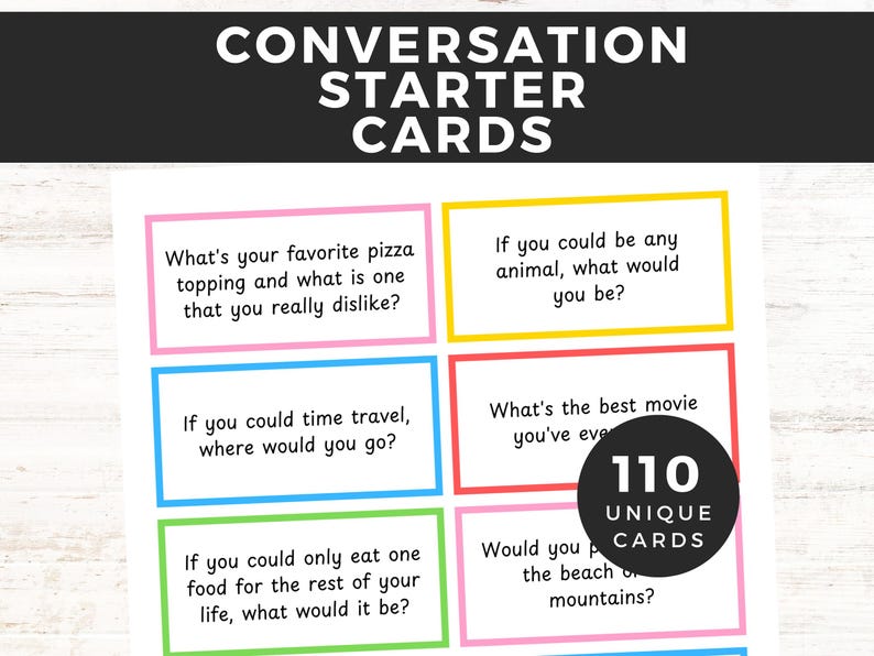 May include: A set of 110 conversation starter cards with colorful borders and unique questions to spark conversation. The cards are printed on white cardstock and feature a variety of topics, including food, travel, and personal preferences.