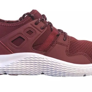 May include: Burgundy colored athletic shoes with a white sole and a mesh upper. The shoes have a lace-up closure and a padded tongue.