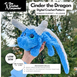 May include: A blue and white crocheted dragon finger puppet and plushie. The dragon has a white horn and tail. The pattern is called "Cinder the Dragon" and is a digital crochet pattern. The pattern is for a finger puppet and plushie. The pattern is for a low sew project and takes 1.5 to 2 hours to make. The necessary skills are basic amigurumi knowledge, the ability to crochet pieces together, and surface crochet.