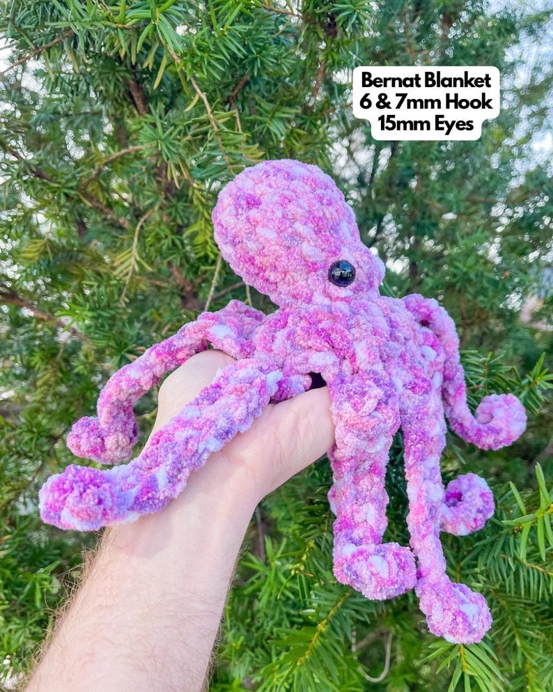 May include: A crocheted purple and white octopus with black eyes. The octopus is made with Bernat Blanket yarn and a 6 & 7 mm hook. The eyes are 15 mm.