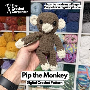 May include: A crocheted monkey plushie in brown and cream, with black eyes. The text "Pip the Monkey" and "Digital Crochet Pattern" are displayed. The Crochet Carpenter logo is in the upper left corner. The monkey can be made as a finger puppet or a regular plushie.