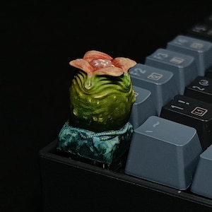 May include: A rustic wooden sign with the text "Welcome to our home" in white lettering. The sign features a distressed finish and a simple, inviting design, perfect for front door decor.