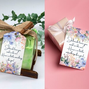 May include: A floral gift tag with the text "Jehovah loves you and so do we! Here's a little something for you!"  The tag is tied with a brown ribbon to a green bar of soap.