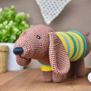 Crochet instructions for a dachshund musical box. Amigurumi dog. Instructions for crocheting. DIY musical box for babies. PDF file. Help for children to fall asleep.