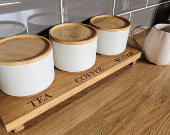 Tea coffee and sugar station ,table riser to display kitchen cannisters ,laser Engraved with  the words Tea, coffee and Sugar, storage stand
