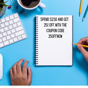 May include: A white notebook with a black spiral binding on a blue surface. The notebook has black text that reads "SPEND $2.50 AND GET 25% OFF WITH THE COUPON CODE 250FFNOW". A hand is holding a yellow pencil and writing on the notebook.