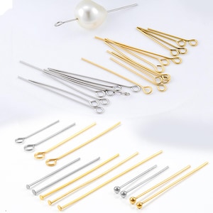 May include: Selection of jewellery making pins and headpins in gold and silver tones. Includes eye pins, headpins with flat and ball ends, and a pearl-topped pin. Suitable for crafting and jewellery design.