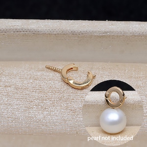 May include: A gold-colored earring clasp with a curved design and a small screw post. The clasp is shown next to a circular inset image of a pearl earring, with the text "pearl not included".