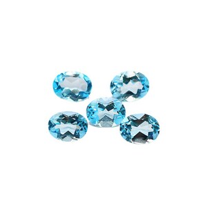 May include: Five oval-shaped, faceted, light blue gemstones on a white background.