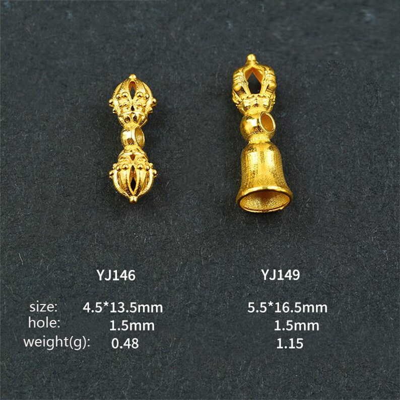 May include: Two gold-colored metal pendants with intricate designs. The pendant on the left is a double-sided design with a small hole in the middle. The pendant on the right is a bell-shaped design with a small hole at the top. The pendants are labeled with their sizes and weights in millimeters and grams.
