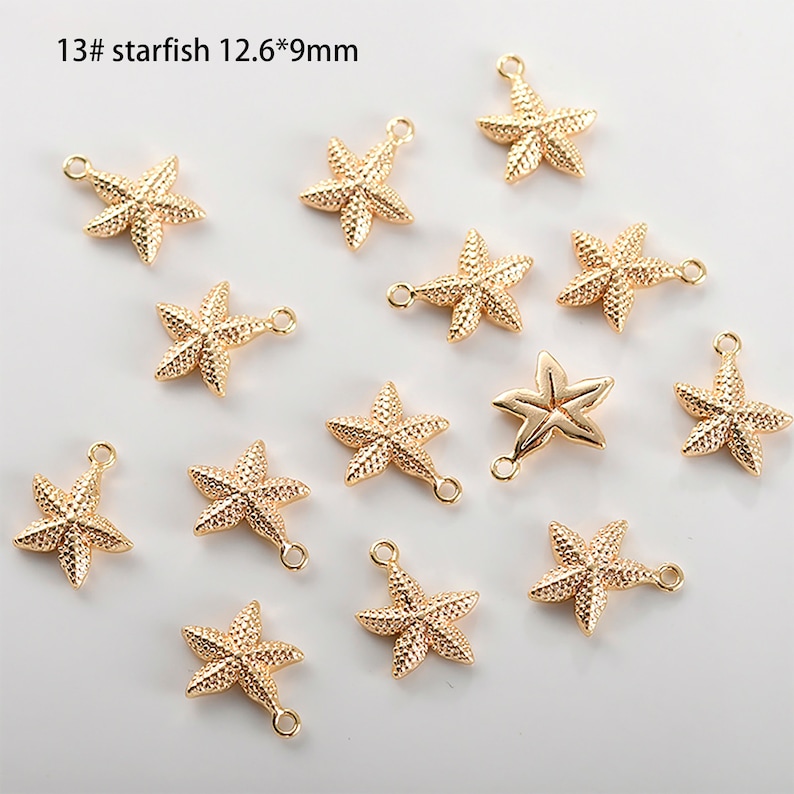 May include: Thirteen gold-tone starfish charms with a loop for attaching to jewellery or other crafts. Each charm measures 12.6 mm by 9 mm.