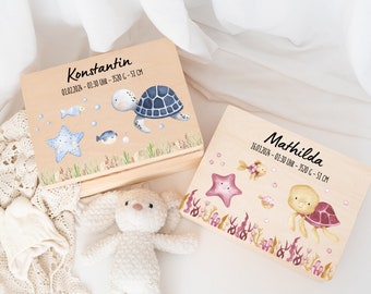 May include: Two wooden keepsake boxes with sea turtle and starfish designs. The boxes are personalized with the names Konstantin and Mathilda, along with birth dates and measurements. The boxes are perfect for storing baby mementos.