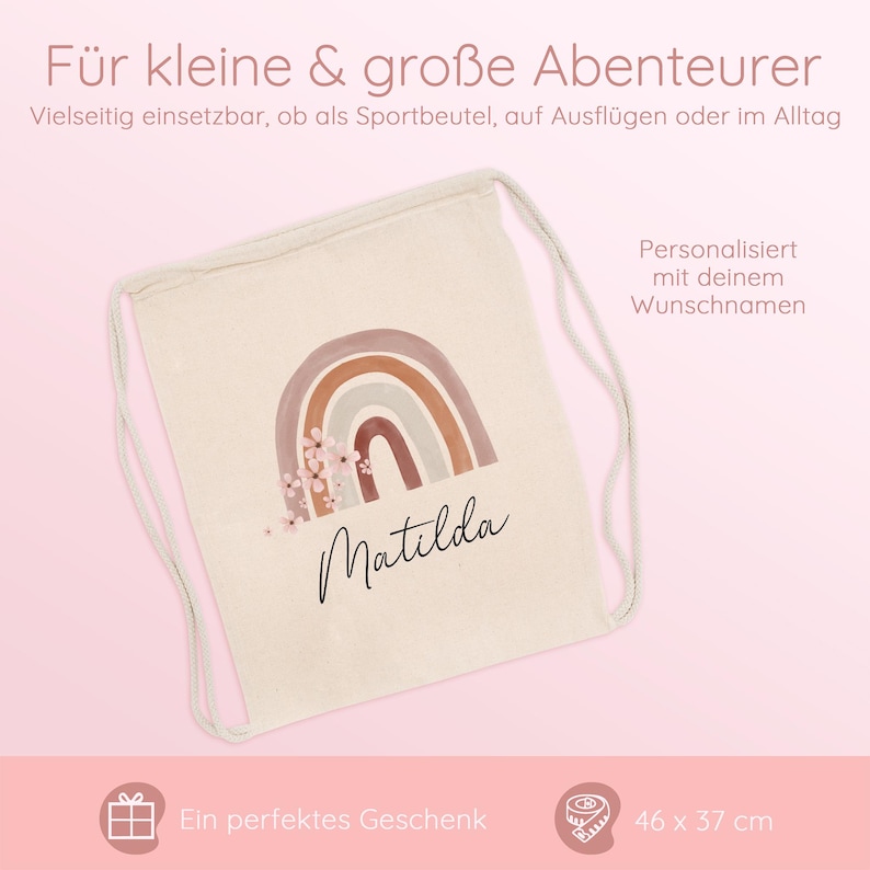 May include: A beige drawstring backpack with a watercolor rainbow design in shades of brown and pink, with the name "Matilda" in cursive. The bag measures 46 cm x 37 cm. Text on the bag says "F&uuml;r kleine & gro&szlig;e Abenteurer" and "Personalisiert mit deinem Wunschnamen."