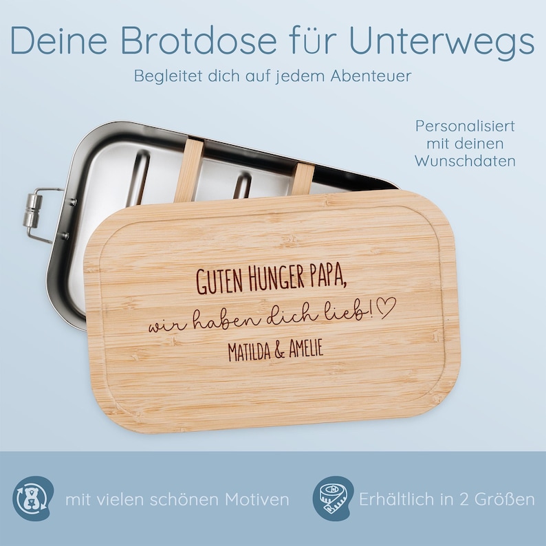 May include: A stainless steel and bamboo lunchbox. The bamboo lid is engraved with the text "GUTEN HUNGER PAPA, wir haben dich lieb!♡ MATILDA & AMELIE". The lunchbox is designed for on-the-go use and is available in two sizes.