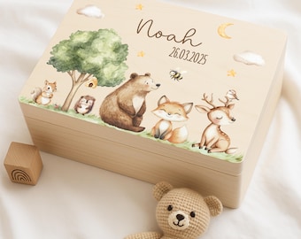 May include: A wooden keepsake box with a light brown finish. The lid features a whimsical woodland scene with a bear, fox, deer, squirrel, and hedgehog. The box is personalized with the name "Noah" and the date "26.03.2025".