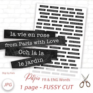 May include: A sheet of black and white Parisian-themed word cutouts, including phrases like "la vie en rose" and "from Paris with Love." Additional words and phrases are printed on a white sheet. A pair of scissors is in the lower right corner.