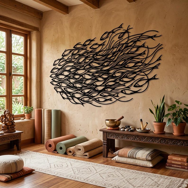 May include: A large black metal wall art piece featuring a stylized school of fish swimming in a fluid, swirling formation. The design consists of numerous interconnected fish silhouettes creating a dynamic, flowing pattern across the wall surface.