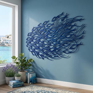 May include: A large, dark blue wall sculpture featuring a dense, flowing school of fish. The intricate metalwork depicts numerous individual fish silhouettes arranged in a dynamic, sweeping formation that creates a sense of movement and depth.