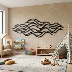 May include: A large, black, horizontal wall art piece featuring a series of interconnected, flowing, wave-like lines. The sculpture is mounted on a light beige, tiled wall above a children's play area containing a wooden bed frame, shelves.