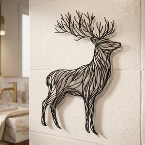 May include: Black metal deer wall art. The deer is depicted in a minimalist style with intricate line work, showcasing the antlers and body. This decorative piece is mounted on a white tiled wall, suitable for home decor.