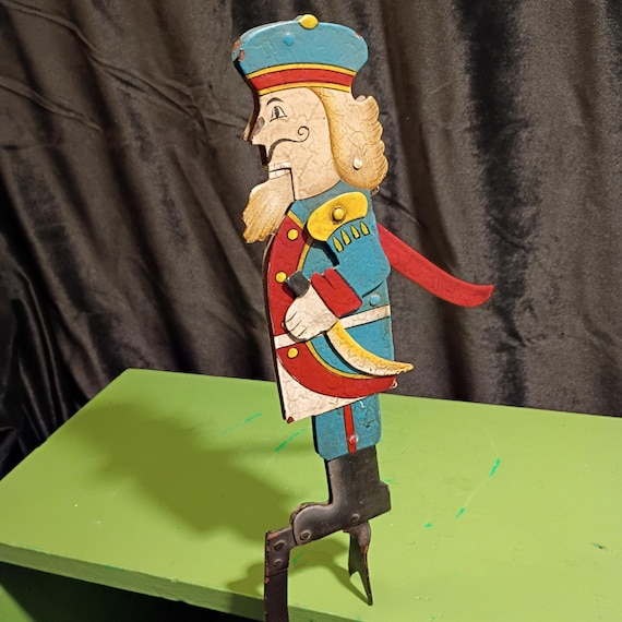 A genuine vintage mid-century kinetic nutcracker soldier with its original tag — a one-of-a-kind antique find that actually moves.
