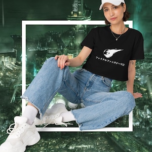 May include: A black cropped t-shirt with a white graphic of a character from the video game Final Fantasy VII. The text "ファイナルファンタジーVII" is written in Japanese below the graphic.