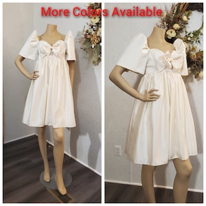 Vanilla cream ( more colors available) Empire cut sweetheart neckline with bow and sherring skirt filipiniana dress.