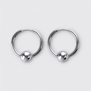 May include: A pair of silver-toned hoop earrings, each featuring a smooth, polished spherical bead centered on the bottom of the circular wire hoop. The earrings have a reflective metallic finish and a simple, clean design with a hinged closure mechanism.
