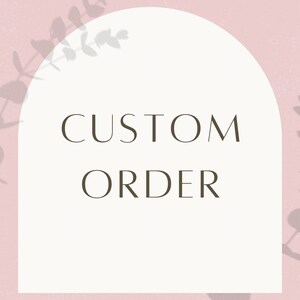 May include: A white arch with the text "CUSTOM ORDER" in brown lettering against a light pink background with a shadow of leaves in the background.