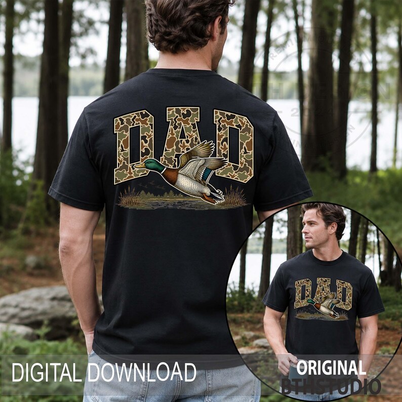 May include: Black t-shirt featuring the word "DAD" in camouflage print, with a detailed illustration of a duck in flight. The shirt is a digital download and includes the "ORIGINAL DTSTUDIO" logo.
