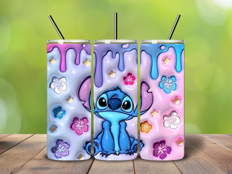 May include: Three insulated tumblers with a Stitch design. Each tumbler features a colorful, dripped paint effect in pink, blue, and purple, adorned with floral and star accents. The tumblers have black straws.