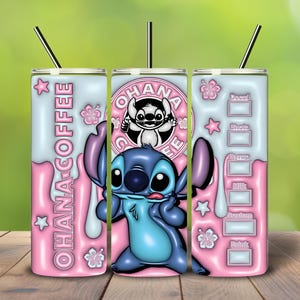 May include: A set of three insulated tumblers featuring a cartoon character. The tumblers have a pink and blue color scheme with the words "OHANA COFFEE" and a coffee order guide. Each tumbler has a black straw.