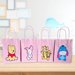 Sacolas de lembrancinhas do Ursinho Pooh e seus amigos.
