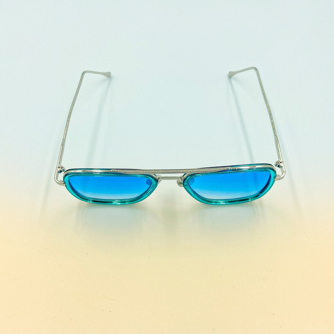Retro sunglasses with light blue lenses and silver metallic Etsy