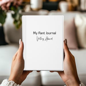 Puede incluir: Un diario blanco con el texto "My Rant Journal Venting Allowed" en la portada.