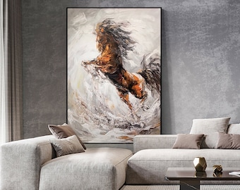 May include: A painting of a brown horse running through a white and gray abstract background. The horse is in mid-air with its legs extended. The painting is framed in a black frame and is hanging on a gray wall.