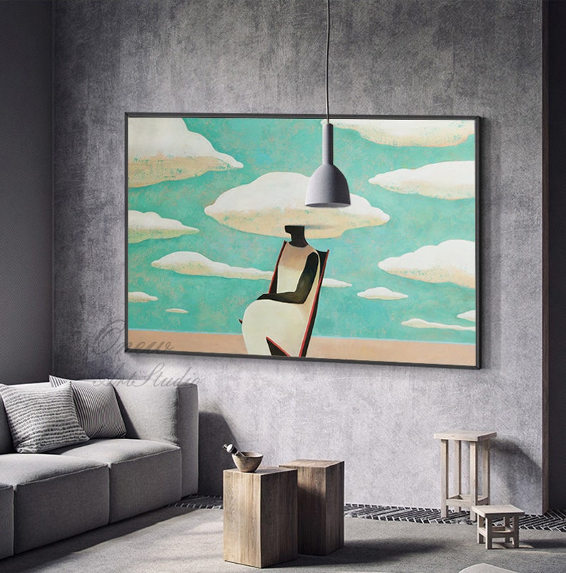 May include: Abstract painting of a person sitting in a chair with clouds above their head. The painting is in a black frame and is hanging on a gray wall.