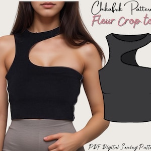 May include: Black Fleur crop top with an asymmetrical design. The top has a cutout detail on the shoulder and neckline. The image includes the text "Chikafrik Patterns Fleur Crop top" and "PDF Digital Sewing Patterns".