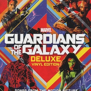 May include: A red, yellow, and blue vinyl record cover with the title "Guardians of the Galaxy Deluxe Vinyl Edition" and the Marvel logo. The cover features characters from the movie, including Star-Lord, Gamora, and Groot.