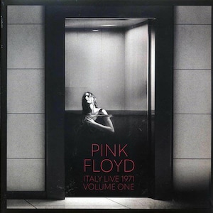 May include: Album cover for Pink Floyd's "Italy Live 1971 Volume One." The image is a black and white photograph of a person in a dark space, with the band's name in red and the album title in white.