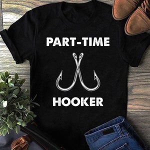 May include: Black t-shirt with white text that reads "Part-Time Hooker" and a graphic of two crossed fishing hooks.