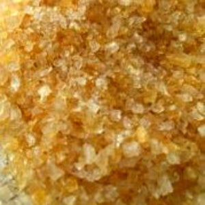 May include: Close-up of clear and amber-colored gelatin granules.
