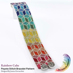 May include: Rainbow Cube Peyote Stitch Bracelet Pattern designed by Jessica Giovacchini. The bracelet is made with colorful beads in a geometric pattern and has silver end caps.